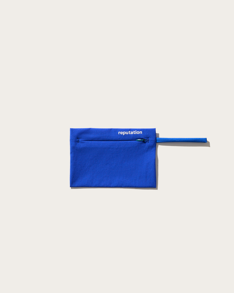 Reputation blue swimwear packaging pouch, flat lay