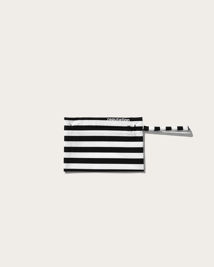 Reputation white and black stripe swimwear pouch, flat lay