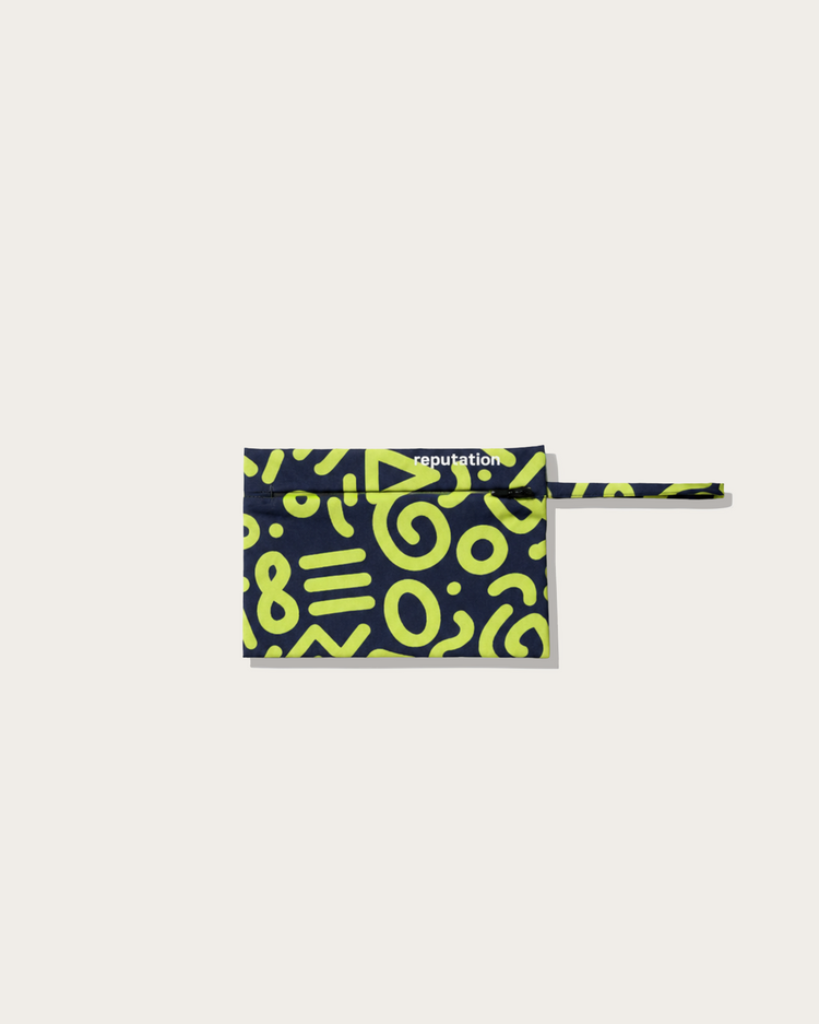 Reputation Glyph print swimwear packaging pouch, alternate flat lay